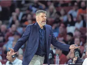  ?? SARAH PHIPPS/THE OKLAHOMAN ?? Oklahoma head coach Porter Moser argues a call during the Sooners’ 71-61 loss to Oklahoma State on Wednesday.