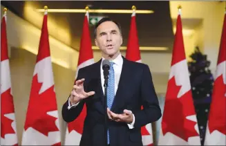  ?? Canadian Press photo ?? Finance Minister Bill Morneau holds a press conference in the media lockup for the fall economic update in Ottawa on Wednesday.