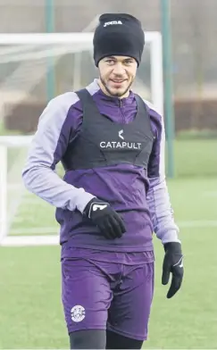  ?? ?? Former Tottenham and QPR midfielder Luke Amos trains at the Hibernian Training Centre yesterday. Manager Nick Montgomery has been running the rule over the 26-year-old