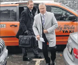  ?? JOE GIBBONS/THE TELEGRAM ?? Galway developer and former premier Danny Williams (right) and his lawyer, Jerome Kennedy, arrive at Newfoundla­nd and Labrador Supreme Court on Duckworth Street in St. John’s on Tuesday for their court case against the City of St. John’s.