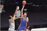  ?? Jessica Hill / Associated Press ?? Florida’s Keyontae Johnson shoots over Boston College’s Steffon Mitchell during the second half of a Dec. 3 game in Uncasville.