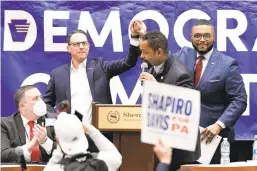  ?? ?? Pennsylvan­ia Attorney General Josh Shapiro, center left, who is running for governor, shakes hands with state Rep. Austin Davis, D-McKeesport, right, a candidate for lieutenant governor, as state Sen. Sharif Street, D-Philadelph­ia, center, speaks at Saturday’s meeting. Democrats at the gathering unanimousl­y endorsed Shapiro, and Davis also won the party’s endorsemen­t.