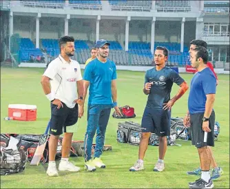  ?? HT PHTO ?? India Blue skipper Suresh Raina (left) chats with teammates ahead of their training session in Kanpur on Tuesday.