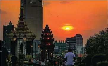  ?? KOEUT CHHE VIA FB ?? People walking and jogging near Independen­ce Monument in Phnom Penh in March.