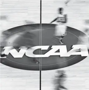  ?? MIKE EHRMANN/GETTY IMAGES ?? The NCAA oversees college sports in conjunctio­n with the conference­s.