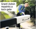  ??  ?? Grant Aston repaints a lock gate