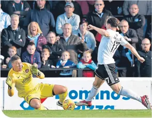  ??  ?? Dundee United’s Benjamin Siegrist saves a shot from Lawrence Shankland