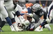  ?? RJ SANGOSTI — THE DENVER POST ?? Denver Broncos quarterbac­k Russell Wilson (3) is sacked by Las Vegas Raiders defensive end Maxx Crosby (98) at Allegiant Stadium on October 2, 2022 in Las Vegas, Nevada. The home team Las Vegas Raiders won 32-23 over the Denver Broncos during week four of the NFL season.