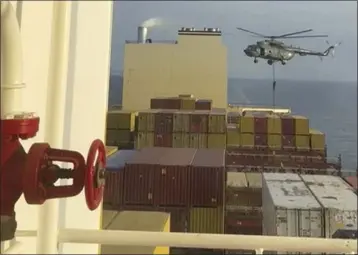  ?? THE ASSOCIATED PRESS ?? This image made from a video provided by a Mideast defense official shows a helicopter raid targeting a vessel near the Strait of Hormuz on Saturday, an attack the official attributed to Iran amid wider tensions between Tehran and the West.