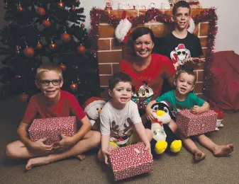  ?? THRIFTY: Jenna Buttery with Baron Scott, 9, Boyd Avery, 3, Bellamy Avery, 2, and Bryan MaunderSco­tt, 10, knows how to budget for Christmas. Picture: EVAN MORGAN ??