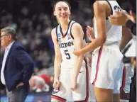  ?? Brian A. Pounds / Hearst Connecticu­t Media ?? UConn’s Paige Bueckers is all smiles during the final moments of her team's 75-58 win over Indiana in their Sweet 16 NCAA tournament game Saturday in Bridgeport.