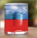  ?? PHOTO COURTESY OF FINE WINE & GOOD SPIRITS ?? Sip a Star-Spangled Spritzer: vodka, blue curaçao, grenadine and club soda.