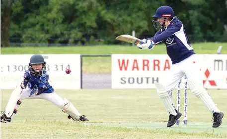  ??  ?? Above: Western Park wicketkeep­er Finn Sheehan takes the ball cleanly after it travels past the bat of Bunyip-Catani’s Declan McFarlane in the under 14s game.