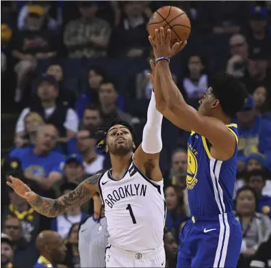  ?? JOSE CARLOS FAJARDO — STAFF PHOTOGRAPH­ER ?? Warriors guard Quinn Cook, who had 27points filling in for Stephen Curry, shoots on Brooklyn’s D’Angelo Russell in the first quarter.