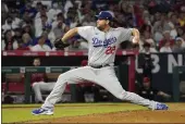  ?? MARK J. TERRILL — THE ASSOCIATED PRESS ?? Los Angeles Dodgers starting pitcher Clayton Kershaw throws to the plate during the seventh inning Friday against the Los Angeles Angels in Anaheim.