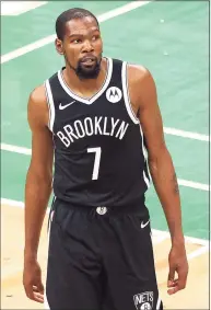  ?? Maddie Meyer / TNS ?? The Brooklyn Nets’ Kevin Durant looks on during a preseason game against the Boston Celtics at TD Garden on Friday in Boston.