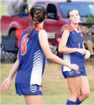  ??  ?? Sisters Lauren Bock (8) and Kaitlyn Bock of Starkville Academy celebrate a goal during Tuesday’s match against Magnolia Heights. (Photo by Danny P. Smith, SDN)