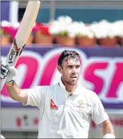  ??  ?? Glenn Maxwell acknowledg­ing crowds after completing his century on Friday.