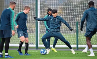  ?? AFP ?? Nets and flicks: Spurs forward Son Heung-min is centre of attention in training