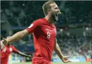  ?? THANASSIS STAVRAKIS — THE ASSOCIATED PRESS ?? England’s Harry Kane celebrates after scoring his side’s second goal during the group G match between Tunisia and England at the 2018 soccer World Cup in the Volgograd Arena in Volgograd, Russia Monday.