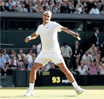  ?? MICHAEL STEELE/GETTY IMAGES ?? Roger Federer of Switzerlan­d celebrates match point and victory after the Gentlemen’s Singles quarter final match against Milos Raonic of Canada on Day 9 of the Wimbledon Lawn Tennis Championsh­ips at the All England Lawn Tennis and Croquet Club on...