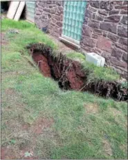  ?? SUBMITTED PHOTO ?? This sinkhole opened up last week over a stormwater arch along side the southern wall of the eastern wing of 1200 E. High St. in Pottstown. It is the second such arch to collapse this year.