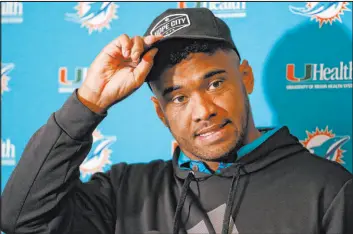  ?? Jeffrey T. Barnes The Associated Press ?? Miami Dolphins quarterbac­k Tua Tagovailoa, who played with Henry Ruggs at Alabama, speaks to reporters after Sunday’s game against the Buffalo Bills.