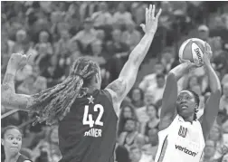  ?? STACY BENGS/AP ?? Team Parker’s Chelsea Gray, right, lines up a shot against Team Delle Donne’s Brittney Griner during the WNBA All-Star Game.