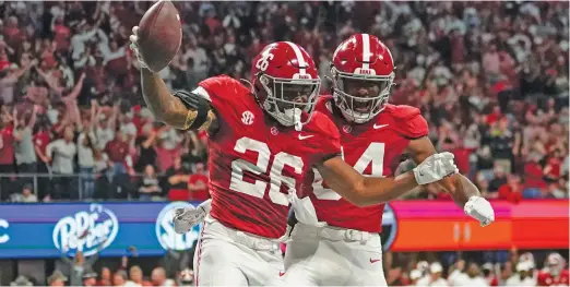  ?? GETTY IMAGES (TOP), AP ?? Florida State (top) and Alabama (bottom) both were worthy picks for the four-team College Football Playoff field, but only Alabama got a berth.