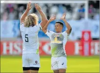  ?? Picture: GETTY IMAGES ?? BEWARE THE WHIPLASH: Werner Kok and Dewald Human react after South Africa’s victory in the HSBC Paris Sevens final on Saturday. But, as some fans held up banners bearing a crude insult to President Jacob Zuma, columnist Jonathan Jansen writes: ‘On the...