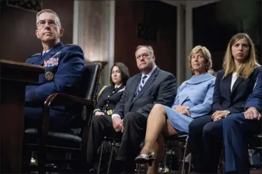  ?? ANDREW HARNIK — THE ASSOCIATED PRESS ?? Gen. John Hyten, left, accompanie­d by members of his family including his wife Laura, second from right, and his daughter Katie, right, appears before the Senate Armed Services Committee on Capitol Hill in Washington, Tuesday for his confirmati­on hearing to be Vice Chairman of the Joint Chiefs of Staff.