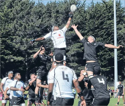  ?? Photo: RHIANNON MCCONNELL ?? Climbing high: Fijian lock Epineri Uluiviti out-jumps his New Zealand Barbarians counterpar­t Quinten Strange in a schoolboy rugby internatio­nal at Porirua Park.