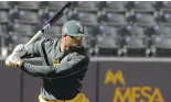  ?? CHRIS CARLSON/ASSOCIATED PRESS ?? A’s center fielder Rajai Davis swings the bat during spring training in Arizona on Thursday.