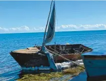  ?? TNS ?? A steel-hulled, makeshift migrant sailboat is grounded near the mangroves of Harry Harris Park in the Upper Keys area of Tavernier on Tuesday.