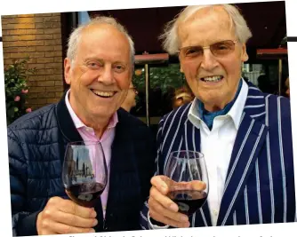 ??  ?? Cheers! Old pals Gyles and Nicholas enjoy a glass of wine