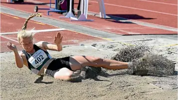  ?? PHOTO: PHOTOSPORT ?? Lydia Bamford, here comepting in the triple jump at the national atheltics championsh­ips last weekend, will be one to watch at the Manawatu secondary schools championsh­ips this weekend.