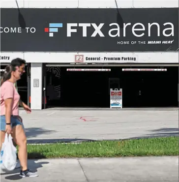  ?? — Reuters ?? Taking action: The logo of FTX is seen at one of the parking entrances of the FTX Arena in Miami, Florida. The National Basketball Associatio­n’s Miami Heat says the stadium will
be renamed.