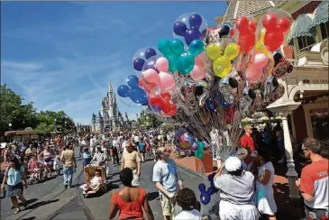  ?? RICARDO RAMIREZ BUXEDA/ORLANDO SENTINEL/TNS ?? Before Walt Disney World reopens in July in Orlando, it has announced some big changes, including the suspension of park hopping, and altering annual events.