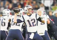  ?? David J. Phillip / Associated Press ?? Quarterbac­k Tom Brady and the Patriots will face off against the Chiefs on Sunday.