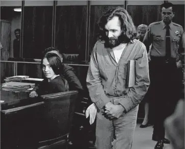  ?? Associated Press ?? CHARLES MANSON walks into a courtroom in Santa Monica in October 1970. At left is one of his followers, Susan Atkins. Manson didn’t commit the murders himself, so in his mind, he wouldn’t go to prison for them.