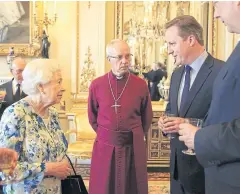  ?? REUTERS ?? Britain’s Queen Elizabeth II speaks with British Prime Minister David Cameron, second right, during a reception in Buckingham Palace on Tuesday.