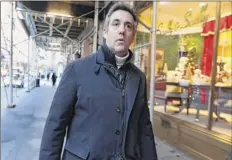  ?? Richard Drew / Associated Press ?? Michael Cohen, former lawyer to President Donald Trump, leaves his apartment building on New York’s Park Avenue, Friday. In the latest filings Friday, prosecutor­s will weigh in on whether Cohen deserves prison time and, if so, how much.