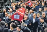  ?? ?? People carry coffins of Yagmur Ucar and Arzu Ozsoy during funeral ceremonies in Istanbul.