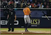  ?? JAE C. HONG — THE ASSOCIATED PRESS ?? The Houston Astros’ Carlos Correa tosses his bat and has words with home plate umpire Lance Barksdale after striking out during the fourth inning in Game 7 of the American League Championsh­ip Series on Saturday in San Diego.