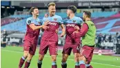  ??  ?? West Ham United players celebrate the winning goal