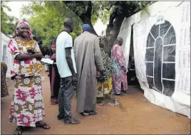  ?? Baba Ahmed ?? The Associated Press Voters in Bamako, Mali, wait to cast their ballots Sunday in the presidenti­al election. Mali is seeing an increase in attacks by a number of extremist groups linked to al-qaida and the Islamic State organizati­on.