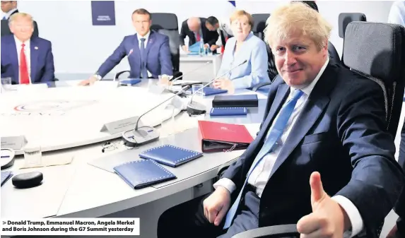  ??  ?? > Donald Trump, Emmanuel Macron, Angela Merkel and Boris Johnson during the G7 Summit yesterday