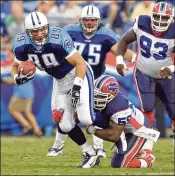  ?? AP ?? Ex-Titans tight end Frank Wycheck (left) wished the Bills luck in the playoffs, 18 years after he threw the key lateral during a kickoff return that gave his team a playoff win over Buffalo in a play dubbed the Music City Miracle.