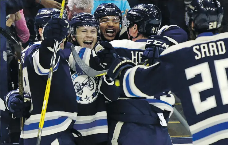  ?? — THE ASSOCIATED PRESS ?? Columbus Blue Jackets, from left, Boone Jenner, William Karlsson, Seth Jones, Scott Hartnell and Brandon Saad, celebrate Karlsson’s goal against the Edmonton Oilers during the second period of their game in Columbus on Tuesday.