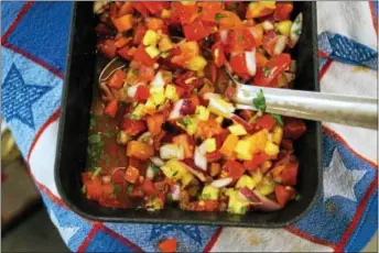  ?? PHOTO BY EMILY RYAN ?? For a twist on tradition, try this fresh tomato and pineapple salsa from Weaver’s Orchard.